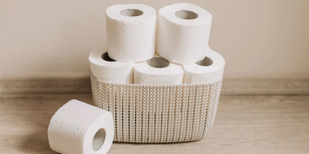 stack of toilet rolls in a basket